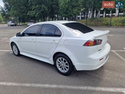 Білий Міцубісі Lancer, об'ємом двигуна 2 л та пробігом 208 тис. км за 7000 $, фото 1 на Automoto.ua