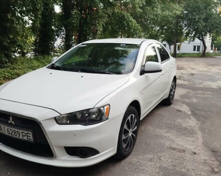 Белый Мицубиси Лансер, объемом двигателя 1.59 л и пробегом 232 тыс. км за 7200 $, фото 1 на Automoto.ua