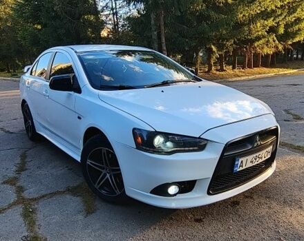 Білий Міцубісі Lancer, об'ємом двигуна 1.6 л та пробігом 242 тис. км за 5800 $, фото 1 на Automoto.ua