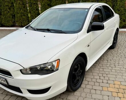 Білий Міцубісі Lancer, об'ємом двигуна 2 л та пробігом 238 тис. км за 7899 $, фото 1 на Automoto.ua