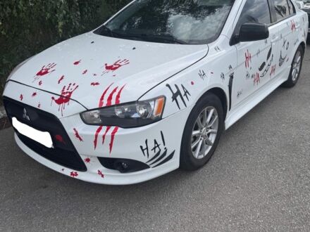 Білий Міцубісі Lancer, об'ємом двигуна 2 л та пробігом 233 тис. км за 8100 $, фото 1 на Automoto.ua