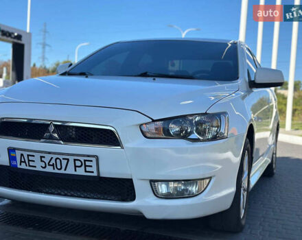 Білий Міцубісі Lancer, об'ємом двигуна 2 л та пробігом 165 тис. км за 7899 $, фото 1 на Automoto.ua