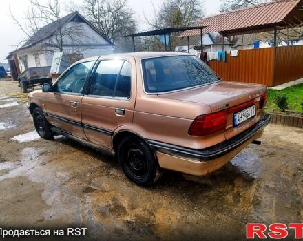 Бежевий Міцубісі Lancer, об'ємом двигуна 2 л та пробігом 235 тис. км за 1000 $, фото 3 на Automoto.ua