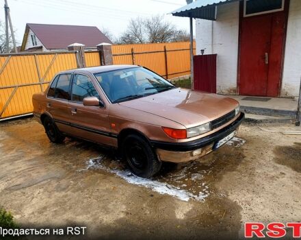 Бежевий Міцубісі Lancer, об'ємом двигуна 2 л та пробігом 235 тис. км за 1000 $, фото 1 на Automoto.ua