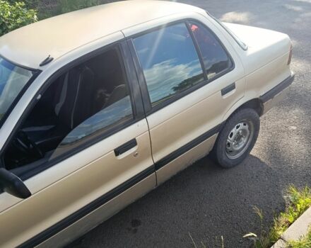 Бежевий Міцубісі Lancer, об'ємом двигуна 1.8 л та пробігом 380 тис. км за 1300 $, фото 1 на Automoto.ua