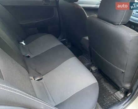 Бежевый Мицубиси Лансер, объемом двигателя 1.5 л и пробегом 242 тыс. км за 5999 $, фото 24 на Automoto.ua