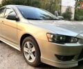 Бежевий Міцубісі Lancer, об'ємом двигуна 2 л та пробігом 132 тис. км за 7500 $, фото 1 на Automoto.ua