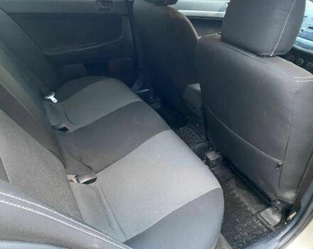 Бежевый Мицубиси Лансер, объемом двигателя 1.5 л и пробегом 242 тыс. км за 5999 $, фото 7 на Automoto.ua