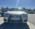 Бежевий Міцубісі Lancer, об'ємом двигуна 2 л та пробігом 138 тис. км за 7500 $, фото 1 на Automoto.ua