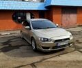 Бежевий Міцубісі Lancer, об'ємом двигуна 2 л та пробігом 270 тис. км за 5400 $, фото 1 на Automoto.ua