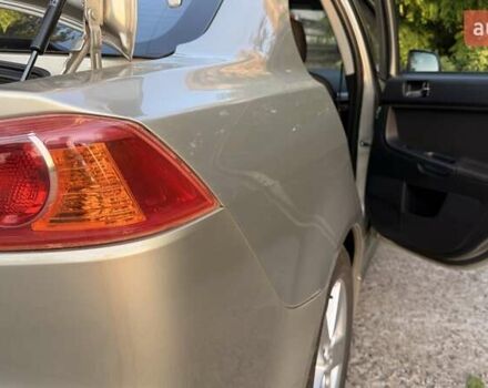 Бежевий Міцубісі Lancer, об'ємом двигуна 2 л та пробігом 132 тис. км за 7500 $, фото 23 на Automoto.ua