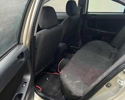 Бежевый Мицубиси Лансер, объемом двигателя 2 л и пробегом 278 тыс. км за 3100 $, фото 11 на Automoto.ua