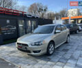 Бежевий Міцубісі Lancer, об'ємом двигуна 2 л та пробігом 250 тис. км за 8400 $, фото 1 на Automoto.ua