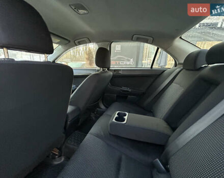 Бежевий Міцубісі Lancer, об'ємом двигуна 2 л та пробігом 250 тис. км за 8400 $, фото 22 на Automoto.ua