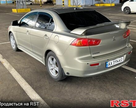 Бежевый Мицубиси Лансер, объемом двигателя 2 л и пробегом 190 тыс. км за 6350 $, фото 3 на Automoto.ua