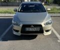 Бежевий Міцубісі Lancer, об'ємом двигуна 2 л та пробігом 264 тис. км за 5600 $, фото 1 на Automoto.ua