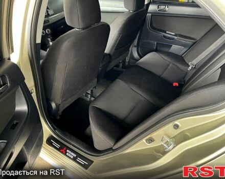 Бежевый Мицубиси Лансер, объемом двигателя 2 л и пробегом 190 тыс. км за 6350 $, фото 9 на Automoto.ua