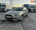 Бежевий Міцубісі Lancer, об'ємом двигуна 1.5 л та пробігом 206 тис. км за 5989 $, фото 1 на Automoto.ua