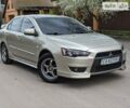 Бежевий Міцубісі Lancer, об'ємом двигуна 2 л та пробігом 148 тис. км за 7800 $, фото 1 на Automoto.ua