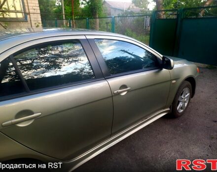Бежевий Міцубісі Lancer, об'ємом двигуна 2 л та пробігом 209 тис. км за 7400 $, фото 9 на Automoto.ua