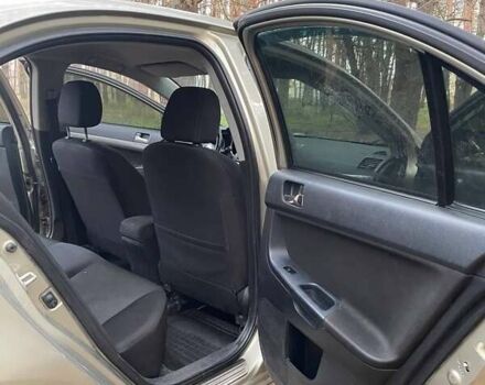 Бежевий Міцубісі Lancer, об'ємом двигуна 2 л та пробігом 262 тис. км за 6500 $, фото 4 на Automoto.ua