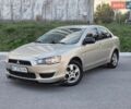 Бежевий Міцубісі Lancer, об'ємом двигуна 1.5 л та пробігом 190 тис. км за 6200 $, фото 1 на Automoto.ua