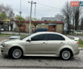 Бежевий Міцубісі Lancer, об'ємом двигуна 2 л та пробігом 262 тис. км за 6000 $, фото 3 на Automoto.ua