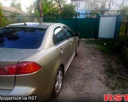 Бежевий Міцубісі Lancer, об'ємом двигуна 2 л та пробігом 209 тис. км за 7400 $, фото 10 на Automoto.ua