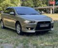Бежевий Міцубісі Lancer, об'ємом двигуна 2 л та пробігом 189 тис. км за 6500 $, фото 1 на Automoto.ua