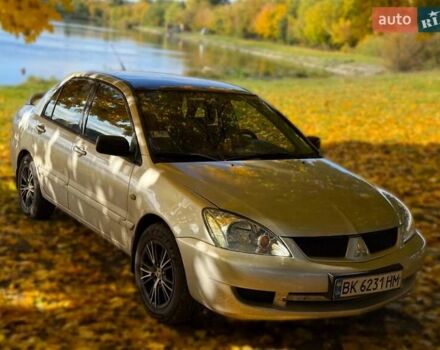 Бежевий Міцубісі Lancer, об'ємом двигуна 1.6 л та пробігом 200 тис. км за 3700 $, фото 11 на Automoto.ua