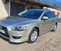 Бежевий Міцубісі Lancer, об'ємом двигуна 2 л та пробігом 125 тис. км за 7350 $, фото 1 на Automoto.ua