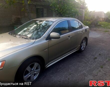 Бежевий Міцубісі Lancer, об'ємом двигуна 2 л та пробігом 209 тис. км за 7400 $, фото 12 на Automoto.ua