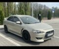 Бежевий Міцубісі Lancer, об'ємом двигуна 2 л та пробігом 260 тис. км за 7400 $, фото 5 на Automoto.ua