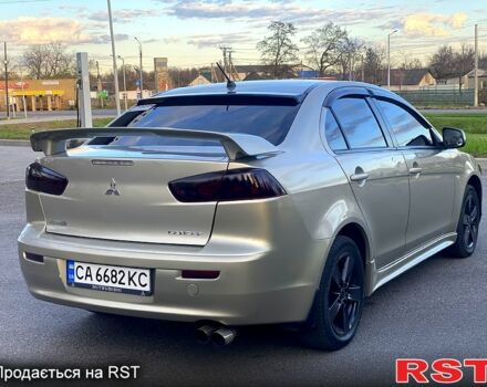 Бежевий Міцубісі Lancer, об'ємом двигуна 2 л та пробігом 171 тис. км за 6950 $, фото 3 на Automoto.ua