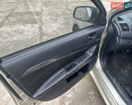 Бежевий Міцубісі Lancer, об'ємом двигуна 2 л та пробігом 312 тис. км за 4700 $, фото 10 на Automoto.ua
