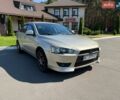 Бежевий Міцубісі Lancer, об'ємом двигуна 2 л та пробігом 156 тис. км за 4990 $, фото 1 на Automoto.ua