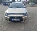 Бежевий Міцубісі Lancer, об'ємом двигуна 2 л та пробігом 340 тис. км за 5700 $, фото 1 на Automoto.ua