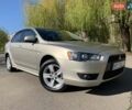 Бежевий Міцубісі Lancer, об'ємом двигуна 2 л та пробігом 175 тис. км за 7650 $, фото 1 на Automoto.ua