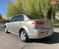 Бежевий Міцубісі Lancer, об'ємом двигуна 2 л та пробігом 175 тис. км за 7650 $, фото 7 на Automoto.ua