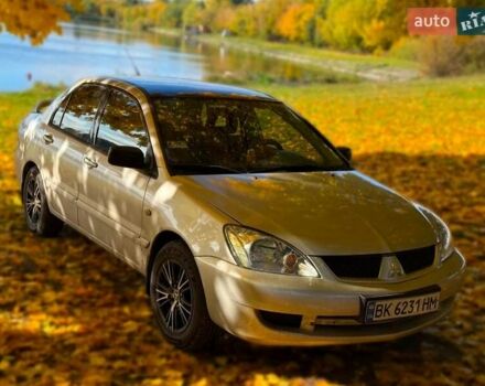 Бежевий Міцубісі Lancer, об'ємом двигуна 1.6 л та пробігом 200 тис. км за 3700 $, фото 1 на Automoto.ua