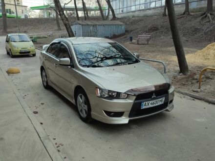 Бежевий Міцубісі Lancer, об'ємом двигуна 2 л та пробігом 65 тис. км за 10000 $, фото 1 на Automoto.ua