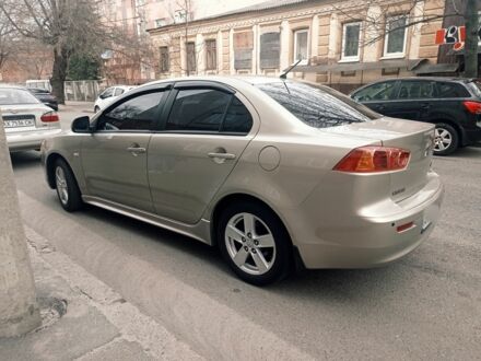 Бежевий Міцубісі Lancer, об'ємом двигуна 2 л та пробігом 190 тис. км за 7700 $, фото 1 на Automoto.ua