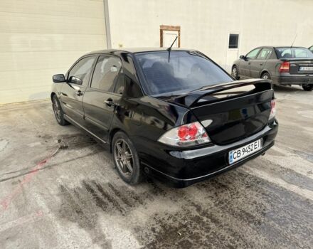 Черный Мицубиси Лансер, объемом двигателя 2 л и пробегом 3 тыс. км за 3700 $, фото 1 на Automoto.ua