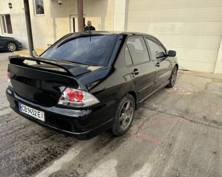 Черный Мицубиси Лансер, объемом двигателя 2 л и пробегом 3 тыс. км за 3700 $, фото 2 на Automoto.ua