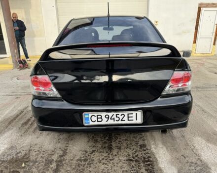 Черный Мицубиси Лансер, объемом двигателя 2 л и пробегом 3 тыс. км за 3700 $, фото 3 на Automoto.ua