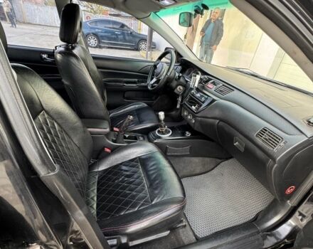 Черный Мицубиси Лансер, объемом двигателя 2 л и пробегом 3 тыс. км за 3700 $, фото 5 на Automoto.ua