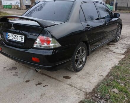 Чорний Міцубісі Lancer, об'ємом двигуна 2 л та пробігом 270 тис. км за 5000 $, фото 5 на Automoto.ua