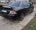 Чорний Міцубісі Lancer, об'ємом двигуна 2 л та пробігом 270 тис. км за 5000 $, фото 5 на Automoto.ua