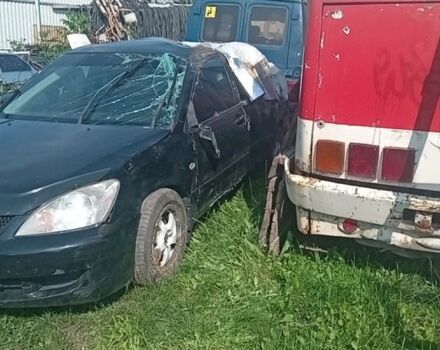 Черный Мицубиси Лансер, объемом двигателя 1.6 л и пробегом 258 тыс. км за 1600 $, фото 2 на Automoto.ua