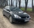 Черный Мицубиси Лансер, объемом двигателя 1 л и пробегом 250 тыс. км за 3800 $, фото 1 на Automoto.ua